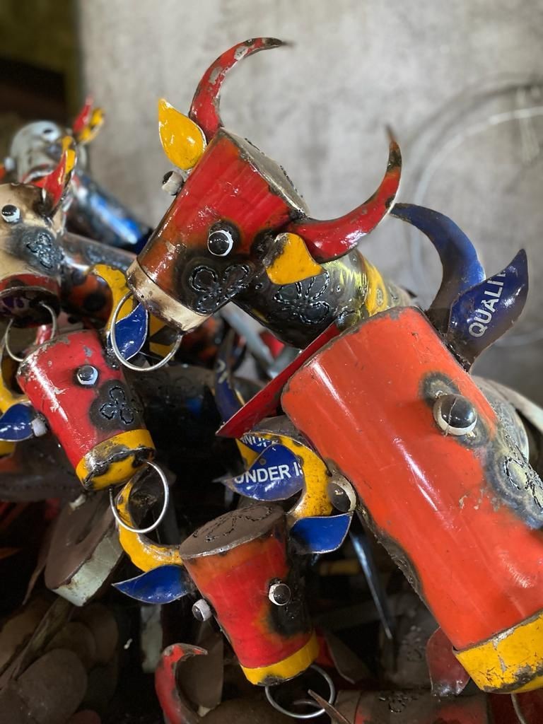 Cow-shaped toy crafted from recycled oil drums, a unique handmade product by Henart.design in Bali
